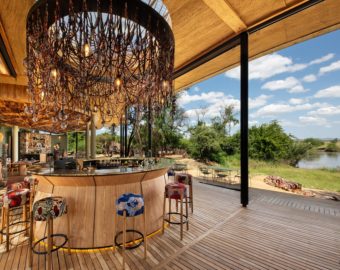tanzania grumeti serengeti river lodge guest area bar with river view e1666250262700 340x270 1