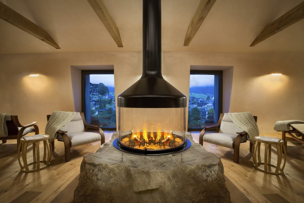 Kempinski Palace Engelberg WellnessSpa Relaxation Room Fireplace copyright Kempinski Hotels