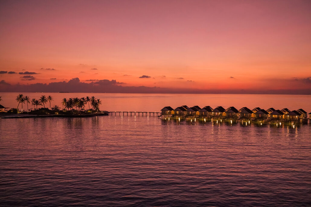 OBLU SELECT Lobigili Island Aerial Sunset Nest Water Villa 02