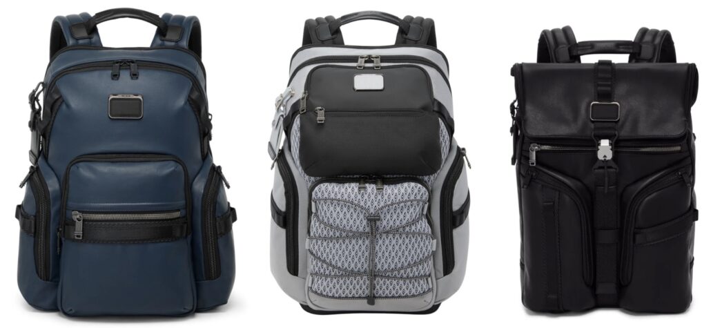 L to R Alpha Bravo Navigation Backpack in Navy Coated Canvas Alpha Bravo Nomadic backpack in Pearl Grey Mesh and Alpha Bravo Surveillance Flap Backpack in Black